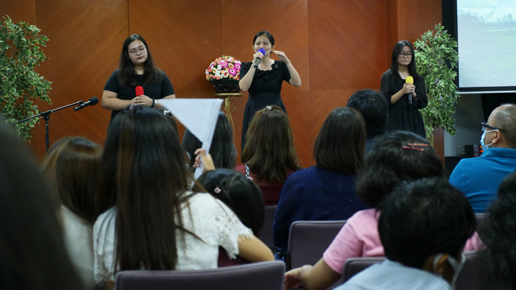 women singing in church in a Filipino church